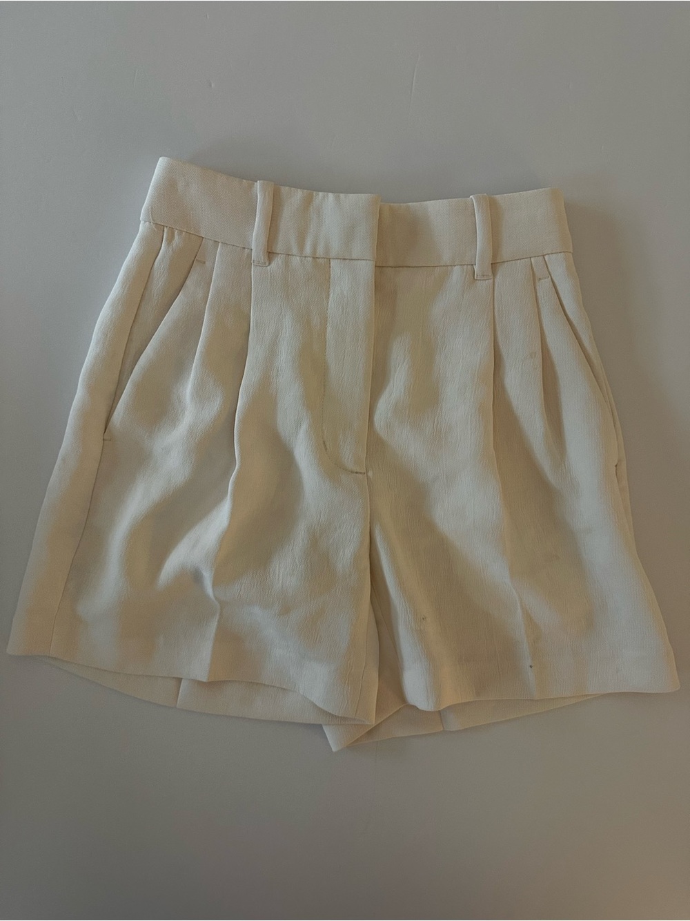 Aritzia Cream High-Rise Pleated Tailored Shorts